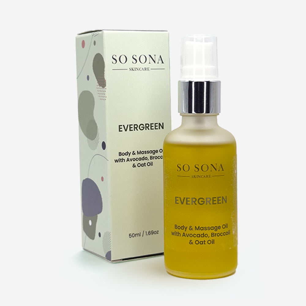 evergreen body oil with packaging on white