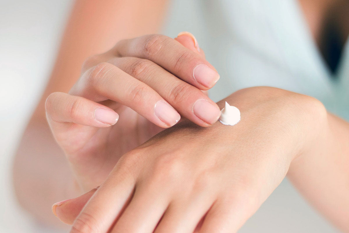 woman doing body butter patch test on hand