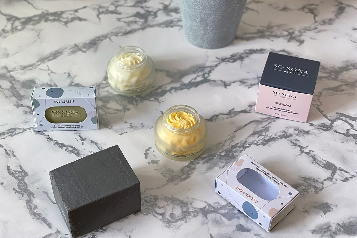 natural skincare products on a marble worktop