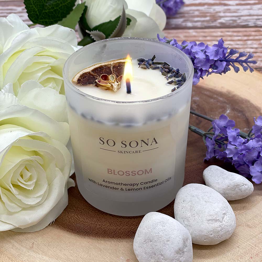 Aromatherapy candle with flowers and stones