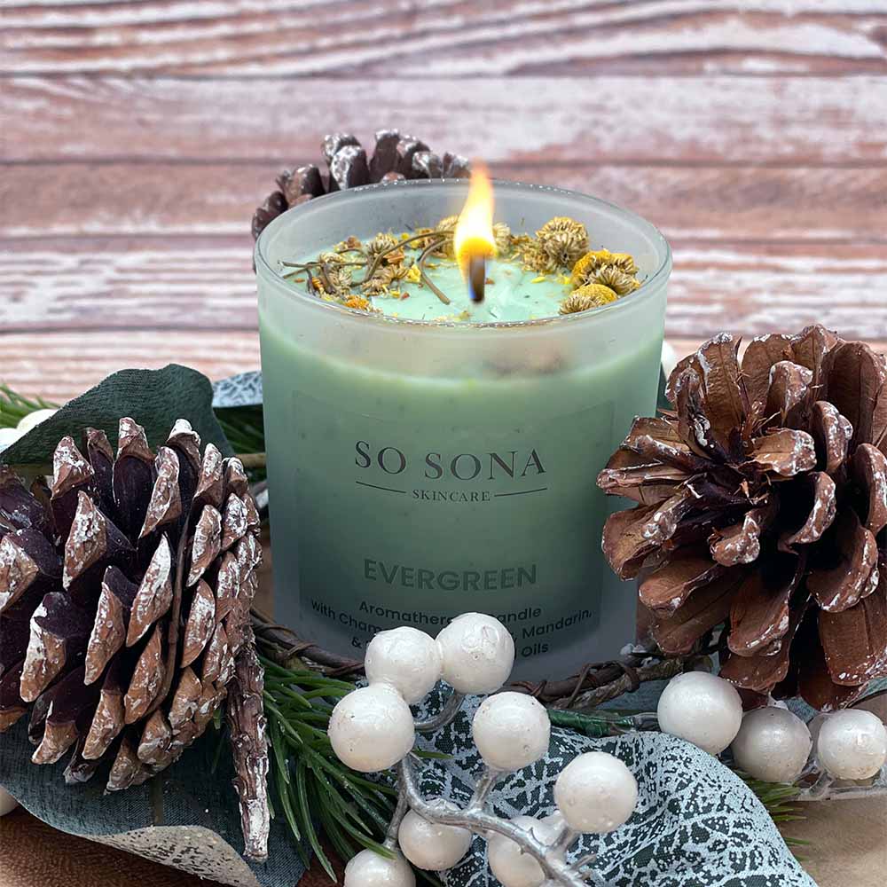 Scented candle with pine cones
