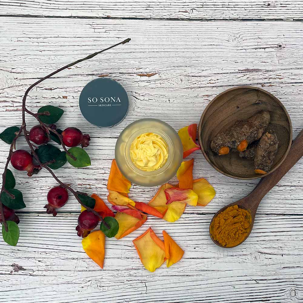 Whipped body butter top view with turmeric and rosehip